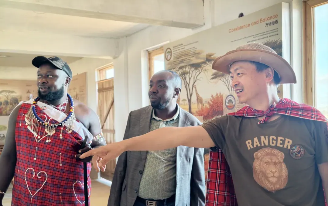 Simba Qiang Zhuo welcoming Maasai elders at the door